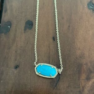 Kendra Scott gold necklace with turquoise stone